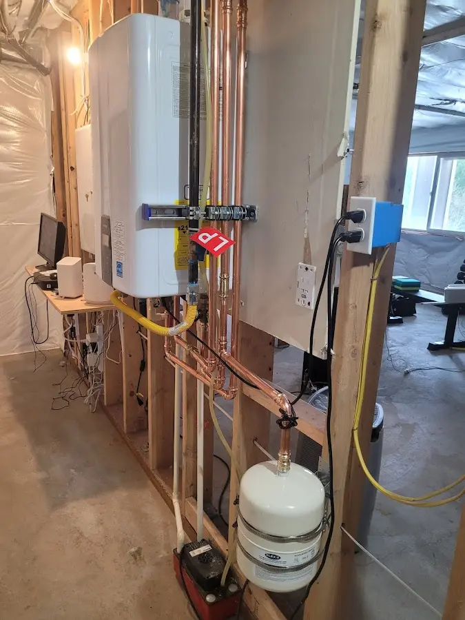 Licensed plumber repairing a kitchen sink in Tysons